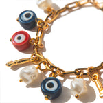 Pulseira Olho Grego Talismã | dourado | vidro, pérolas e corrente metálica | Ene Ene